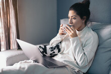 Crop Young Woman Sitting With Laptop And Coffee Cup
