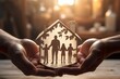 Hand holding paper cutout of family, family home, adoption foster care, homeless support, mental health concept, give you a home, warmth