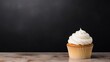  a cupcake with white frosting sitting on a table.  generative ai