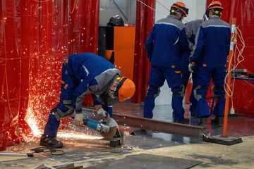Poster - Construction works. Man with circular saw. Worker saws metal. Guy in helmet holds hand-held circular saw. Construction worker uses mask to protect against sparks. Circular saw rental concept