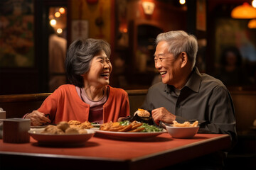 Happy Asian elderly man and woman or family having dinner in restaurant, romance