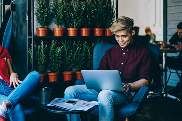 Canvas Print - Smiling colleagues working in creative studio