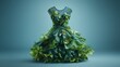 Eco friendly fashion dress made of green leaves on blue background