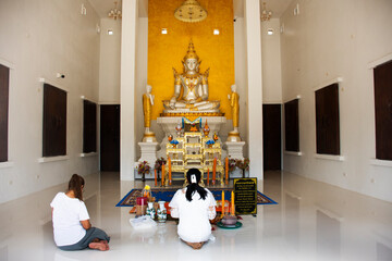 Beauty white ancient buddha in antique ubosot of Wat Pho Khuan Maphrao temple for thai people travelers travel visit respect praying blessing wish mystery on October 12, 2023 in Phatthalung, Thailand