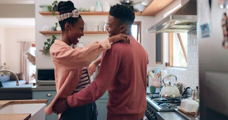 Wall Mural - Dance, hug and couple in kitchen laughing together for having fun, bonding and playful relationship. African, apartment and happy man and woman for affection, embrace and relax in home with music