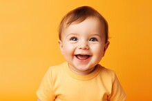 Baby Smiling And Looking Up To Camera On A Yellow Background