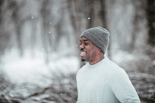 Happy Young Man Working Out In Park During Winter