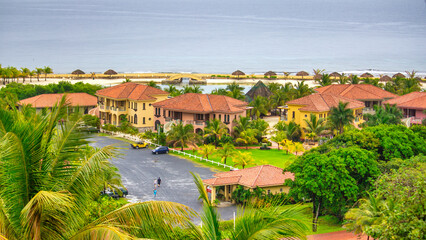 Canvas Print - Buildings of Roatan around the trees, Honduras