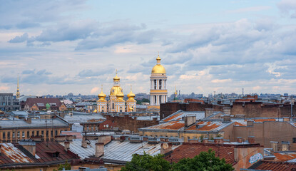 Wall Mural - top view of the city roofs in the historical center of Saint Petersburg before the onset of a thunderstorm