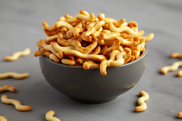 Wall Mural - Crunchy Organic Mini Crackers in a Bowl, side view.