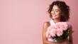 © Tahir - This portrait features an attractive girl who is cheerful, dreamy, holding flowers, and is deciding while copy space is available on a pink pastel background.