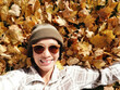 Selfie woman on autumn maple leaves in British Columbia Canada