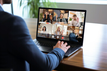 Wall Mural - businessman having video conference call with colleagues. remote workers discussing work plans by video digital conference call on laptop.