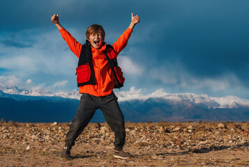 Sticker - Happy emotional boy tourist on mountains background at autumn