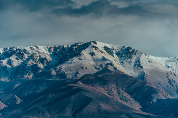 Sticker - Picturesque mountain landscape with snowy peaks and clouds