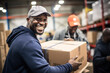 Photo of a cheerful man with a package in a warehouse