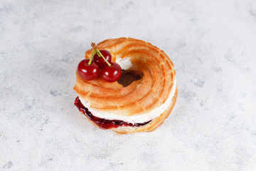 Wall Mural - Cream puffs with whipped cream and sour cherries.