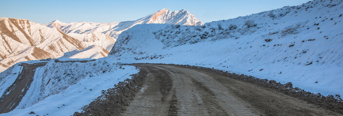 Canvas Print - road in the snowy mountain