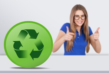 Wall Mural - Business woman and green card with Recycle symbol.