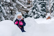 © Nikola - Little girl playing in a deep snow