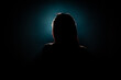 unrecognizable woman head silhouette on black background