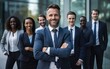© Kowit - Businessman standing folded hand smile, businessman and businesswoman over big group of businesspeople background
