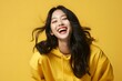 © Rax Qiu - portrait of an asian woman on a yellow background