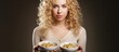 Goldilocks like woman presenting bowls of varying temperature porridge With copyspace for text