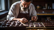 Portrait of chocolatier creating artisanal chocolate pralines in precision and creativity for sweet desserts