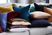 pile of reunion cushions on a couch