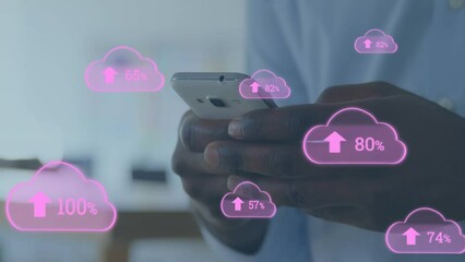 Poster - Animation of multiple cloud data upload icons against mid section of a man using smartphone at home