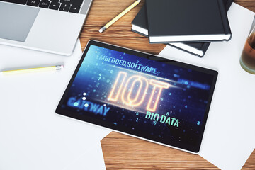 Poster - Creative IOT hologram on modern digital tablet screen, internet of things concept. Top view. 3D Rendering