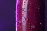 Fototapeta Dmuchawce - Lipstick with water drops on purple background, macro view. Space for text