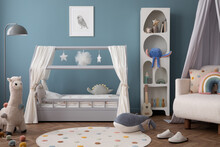 Creative Composition Of Child Room Interior With Mock Up Poster Frame, Cozy Bed, Stylish Rack, Blue Wall, Rack With Toys, Plush Lama, Gray Lamp, Guitar And Personal Accessories. Home Decor. Template.