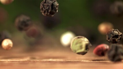 Sticker - Peppercorn falling on the table. Macro shot. Filmed on a high-speed camera at 1000 fps. High quality FullHD footage