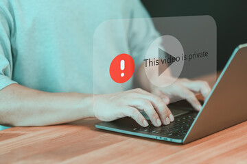 Poster - Adult man using a laptop to play social media but this video is blocked or privacy settings have been set. Searching for more internet, and search engine optimization. Subscribing and following.
