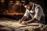 Fototapeta  - A man wearing a chef's apron is seen in the process of making dough. This image can be used to showcase the culinary skills of a chef or to illustrate the art of baking