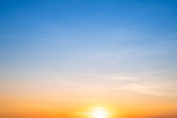 Wall Mural - beautiful of luxury soft gradient orange gold clouds and sunlight on the blue sky perfect for the ba