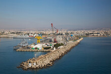 Docked Warship At Wharf With Gantry Cranes And Man-made Breakwater In Limassol Port; Cyprus