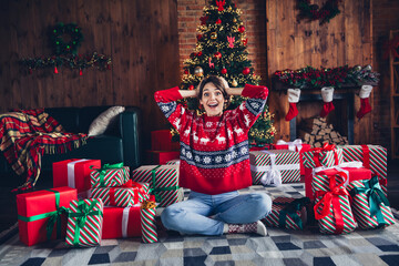 Sticker - Photo of lovely young lady sit floor crossed legs hands head dressed stylish red sweater christmas tree decorated interior living room