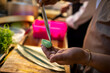 © Marko Geber - Close up of a sushi chef cutting avocado
