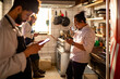 © Marko Geber - Young sushi chef using a smartphone on a coffee break in the restaurant