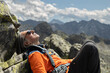 © Guzel - Close-up of man enjoying rest after climbing mountain peak, Austria