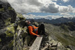 © Guzel - Profile of a man on top, on a bench, against the background of a delightful mountain landscape on a summer day, Austria