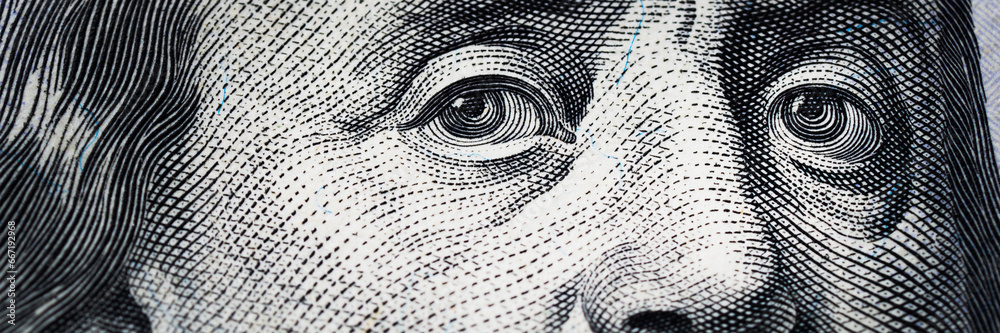 Benjamin Franklin's eyes from a hundred-dollar bill. The eyes of ...