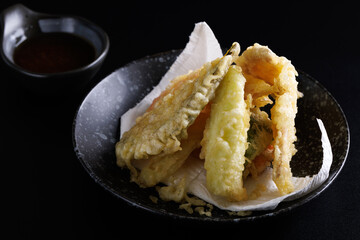 Wall Mural - Mix tempura with shrimp fish and vegetable Japanese food isolated in black background