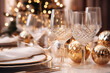 Christmas table setting with candles and festive tableware and golden decor for Christmas celebration