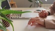 Anxiety, Stress, Boredom, Impatience And Nervousness Related To Work. Unrecognizable Woman's Hand That Anxiously Taps Her Desk With Her Fingers While Working On Laptop At Office.