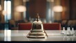 a hotel service bell elegantly placed on a pristine white glass table, setting the stage for a luxurious travel experience.