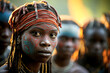 © ADDICTIVE STOCK - Generative AI illustration of portrait of african female of authentic tribe wearing blue and red face painting and accessories while standing against blurred people and looking at camera